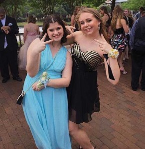 Sydney, left, with Lindsay at the Plano West Best Buddies Prom in May. Sydney says of Lindsay, "She is nice and pretty and she's my best buddy!"