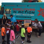 The Executives in Action Kindness truck offers Random Snacks Of Kindness to students at St. Phillips School and Community Center in Dallas.