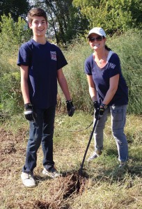 Melissa Chaiken with son, Spencer, 15, working at Plano Community Garden as volunteers from the YMSL Silver Star Chapter.