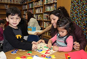 Parents and their preschool aged children spend 20 hours a week learning together at two sites in Plano ISD: Plano Family Literacy School and Sigler Elementary School. Pictured: Carolina Escobar, Jose and Zoe