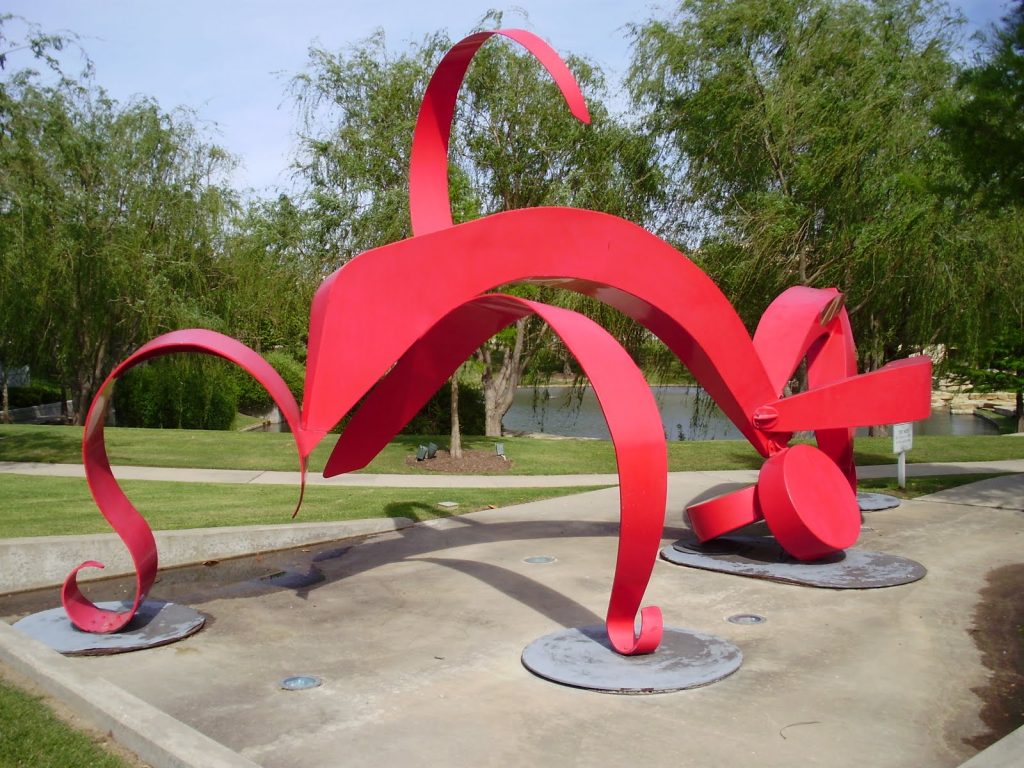 Part of Hall Park's Texas Sculpture Garden are hundreds of one-of-a-kind pieces. Pictured here is "La Mujer Roja", a steel and paint sculpture by Houston-based artist Michelle O’Michael