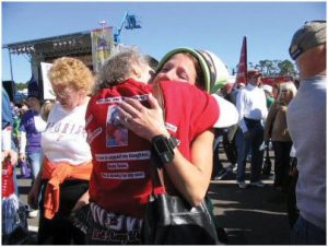 “My mother taught us love, responsibility, forgiveness and perseverance,” says Selec, shown here hugging her mom, Beverly Darcey, at her first race at Disney World in honor of Trey.