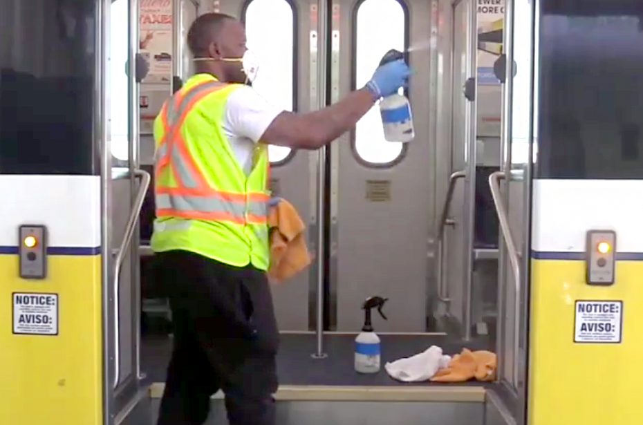 man cleaning bus